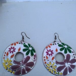 Circular silver colored flower earrings